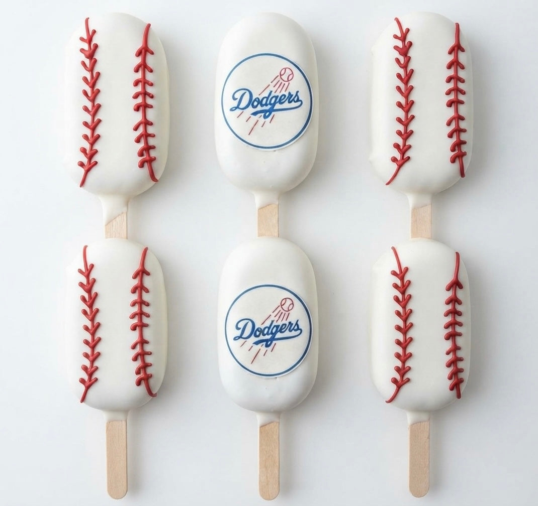 Dodgers cakesicles 12 count with chocolate coating and baseball-themed decorations.
Handmade Dodgers cake popsicles for baseball parties, birthdays, and game-day celebrations.
Custom Dodgers-themed cakesicles with baseball decorations for sports fans and special events.
12 chocolate-covered Dodgers cakesicles arranged for a baseball-themed dessert table.
