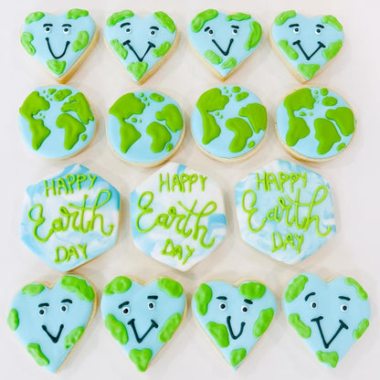 12 count Earth Day sugar cookies shaped like planet Earth and green leaves for eco-friendly party favors