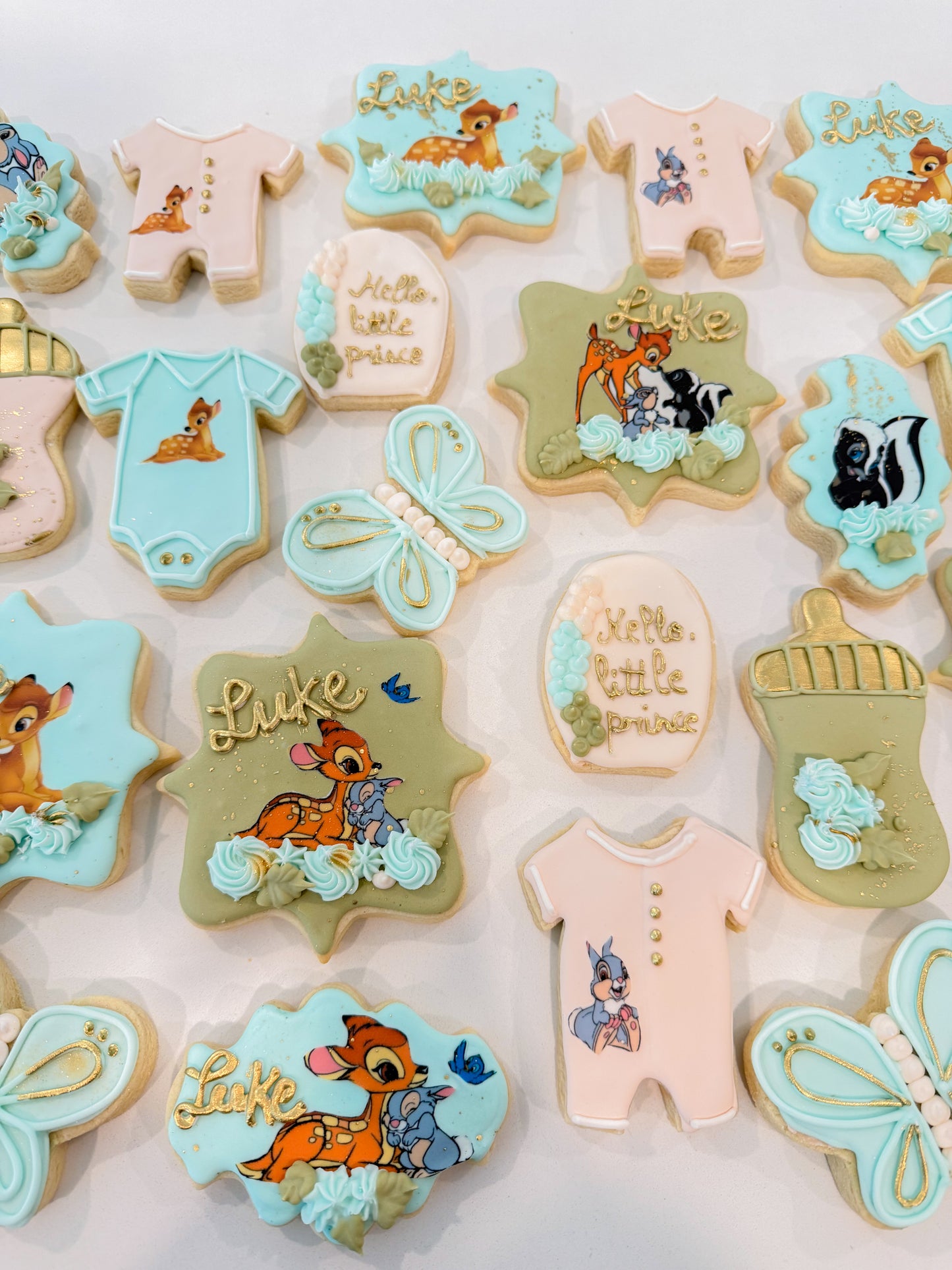 Custom Bambi baby shower cookies individually decorated for a woodland baby shower dessert table.
Woodland-themed baby shower sugar cookies featuring Bambi-inspired designs and cute floral details.