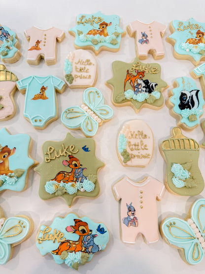 Custom Bambi baby shower cookies individually decorated for a woodland baby shower dessert table.
Woodland-themed baby shower sugar cookies featuring Bambi-inspired designs and cute floral details.