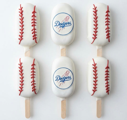Dodgers cakesicles 12 count with chocolate coating and baseball-themed decorations.
Handmade Dodgers cake popsicles for baseball parties, birthdays, and game-day celebrations.
Custom Dodgers-themed cakesicles with baseball decorations for sports fans and special events.
12 chocolate-covered Dodgers cakesicles arranged for a baseball-themed dessert table.