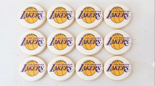 12 handmade Lakers logo cookies decorated with basketball-inspired designs, perfect for Lakers fans, birthdays, game days, and sports celebrations
Lakers logo sugar cookies 12 count for basketball parties and game-day celebrations.
Custom Lakers basketball cookies decorated for birthdays, watch parties, and sports events.
Hand decorated Lakers-themed cookies for basketball fans and party favors.